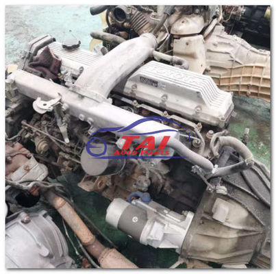 Buen precio TOYOTA LANDCRUSIER 1HZ MOTOR usado montado con caja de cambios en línea